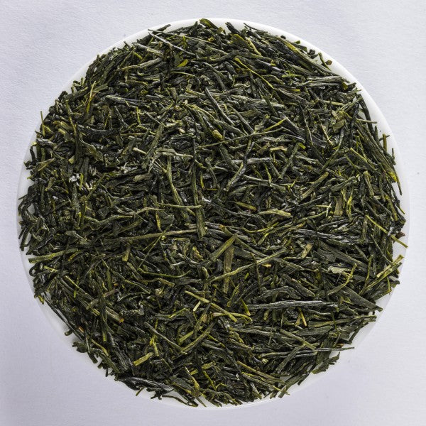 A pile of deep green, shiny Miyazaki Gyokuro green tea leaves.