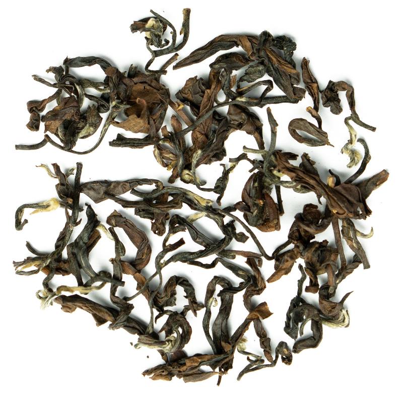 Oriental Beauty Superior loose-leaf Taiwanese oolong tea with delicately twisted leaves and a warm amber infusion by Lunula Tea.