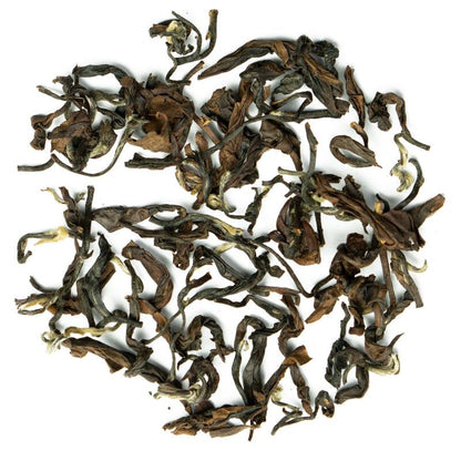 Oriental Beauty Superior loose-leaf Taiwanese oolong tea with delicately twisted leaves and a warm amber infusion by Lunula Tea.