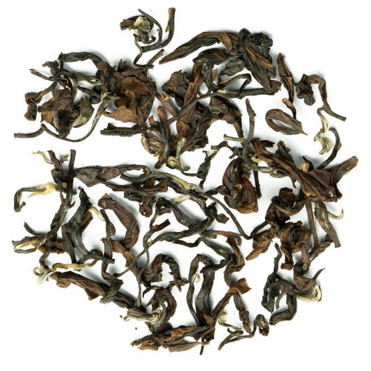 Oriental Beauty Superior loose-leaf Taiwanese oolong tea with delicately twisted leaves and a warm amber infusion by Lunula Tea.
