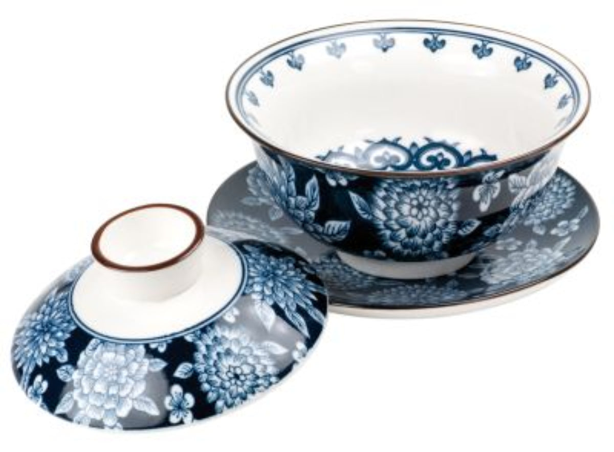 Porcelain bowl and lid with blue floral patterns on a white background