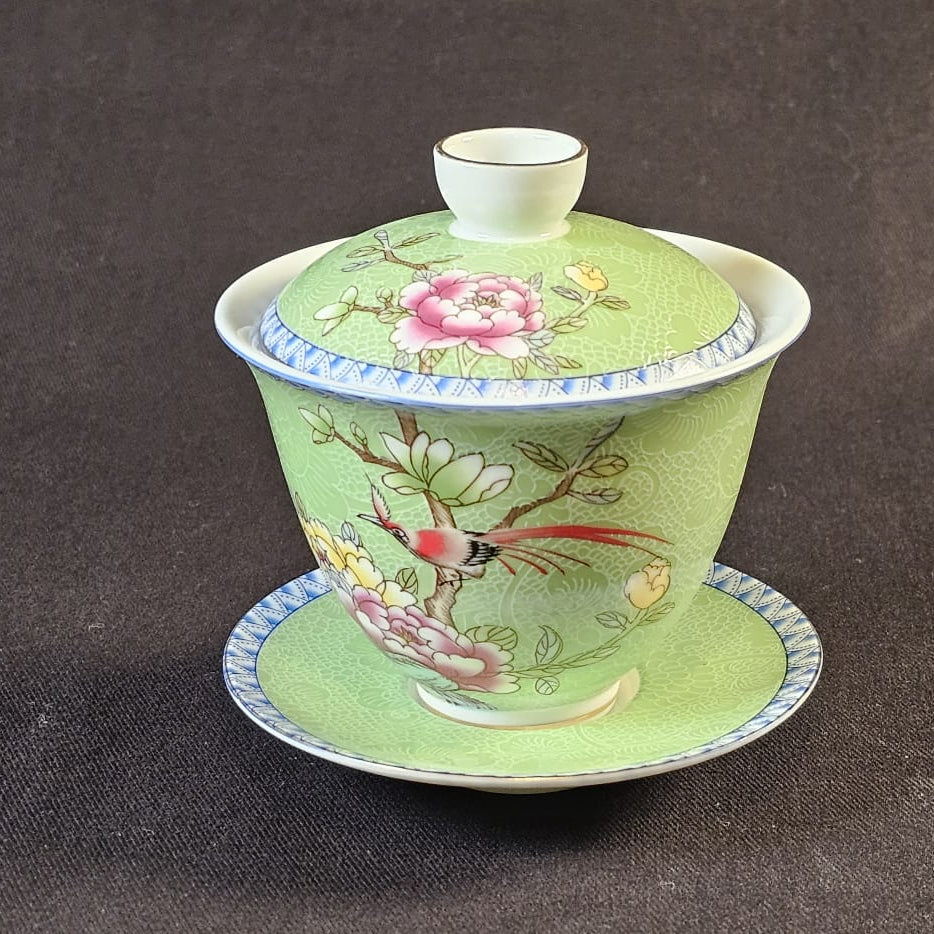 Porcelain green Gaiwan with floral design.