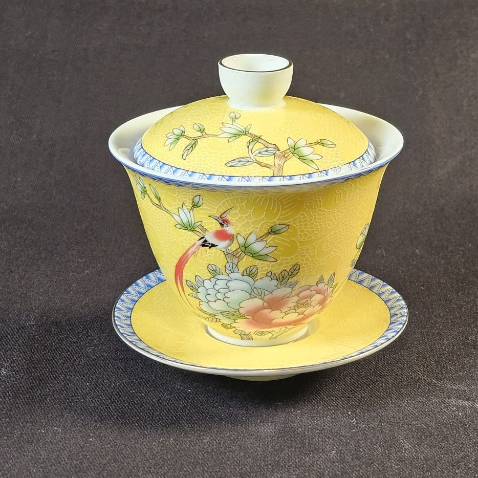Yellow Porcelain Gaiwan with floral design.