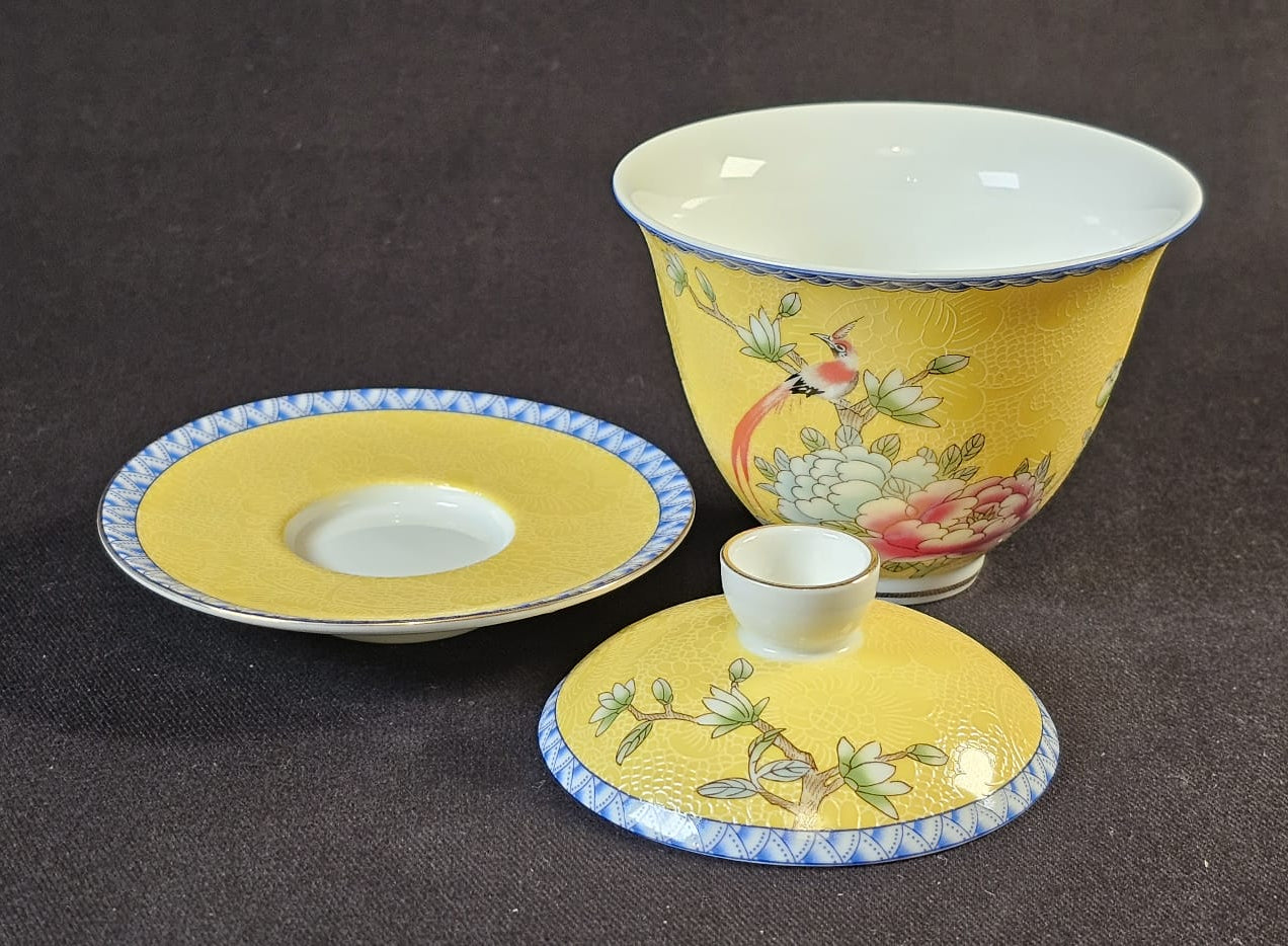 Yellow Porcelain Gaiwan with floral design.
