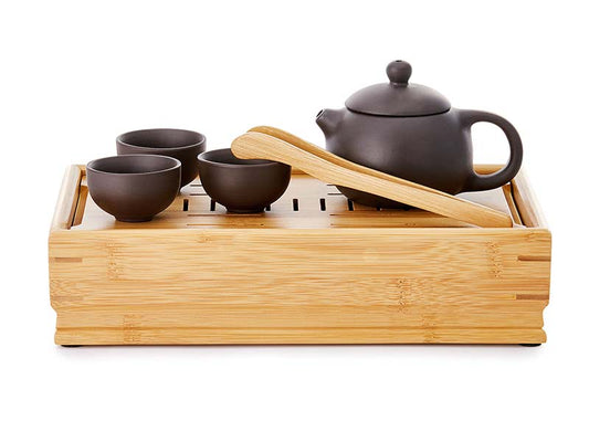 6 pieces Tea ceremony set consist of 3 zisha clay cups 30ml, zisha clay tepot 160ml, bamboo tong and bamboo table. Cups and teapot in brown but table and tong in natural bamboo color.